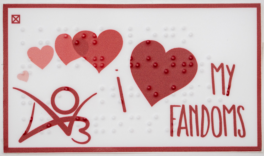 Sticker blanc horizontal avec un logo AO3 en bas à gauche et 4 cœurs rouges de taille croissante avec les mots 'my fandoms'. Les images ont une surimpression en braille qui indique 'kudos logo/with big hearts/"I [heart]/my fandoms"' (logo kudos / avec de grands cœurs "I [heart]/ mes fandoms).